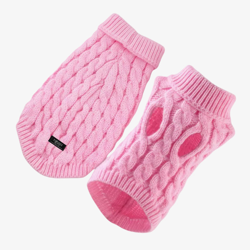 Pink knitted pet sweater with cable pattern on a white background, branded 'Pawsome Pets New York'.
