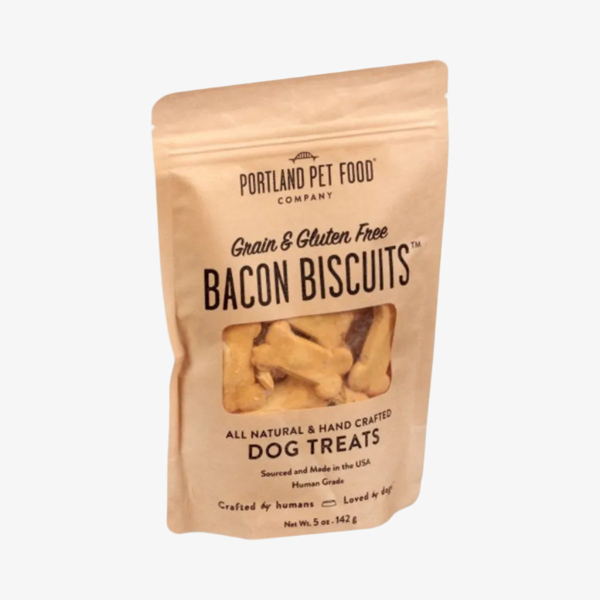 Package of Portland Pet Food Company Bacon Biscuits dog treats on a white background